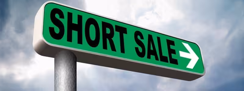 Homeowner reviewing short sale paperwork with attorney to discuss bankruptcy and foreclosure options