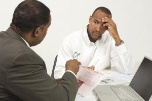 Attorney explaining new debt collection rules to client