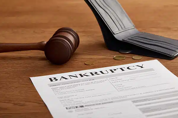 Bankruptcy form with wooden gavel,
